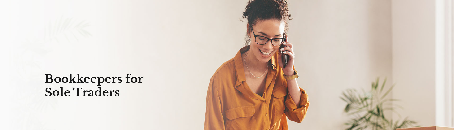 Woman smiling whilst talking on the phone